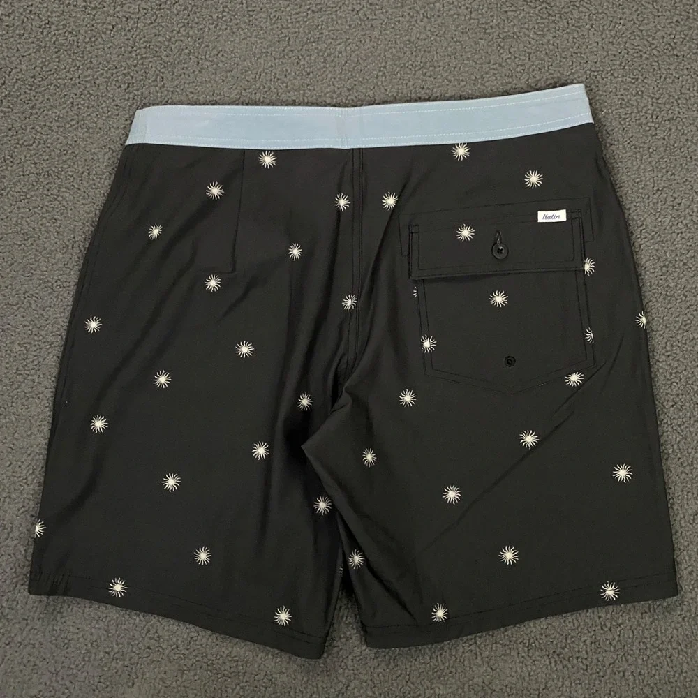 NWOT Katin Black Swim Hybrids with Light Blue Waistband & White Starburst Print